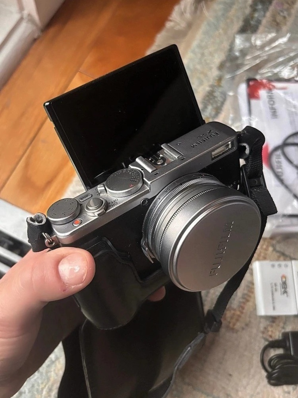 FujifilmX70 with leather case, three batteries/charger and original manual